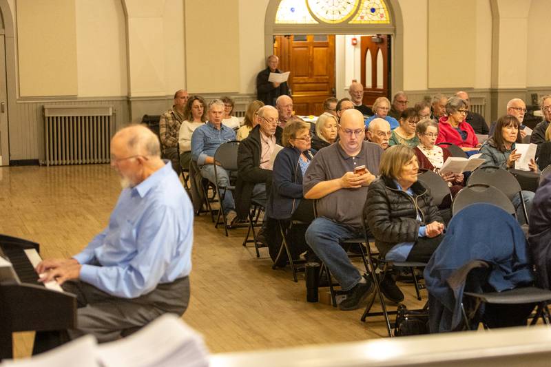 Locals gather with area faith leaders at the International Peace Vigil on Sunday, Nov. 23, 2025, at Shannon Hall in Batavia.