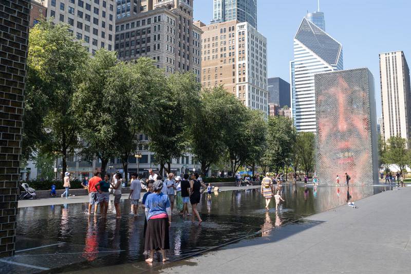 Chicagoans look to beat the heat at the Crown Fountain in downtown Millennium Park on Thursday, Aug. 24, 2023.