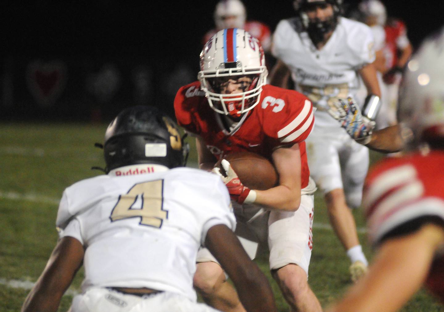 Ottawa ballcarrier Hayden Swett braces for impact as Sycamore's Tyler Curtis prepares to tackle him at King Field.