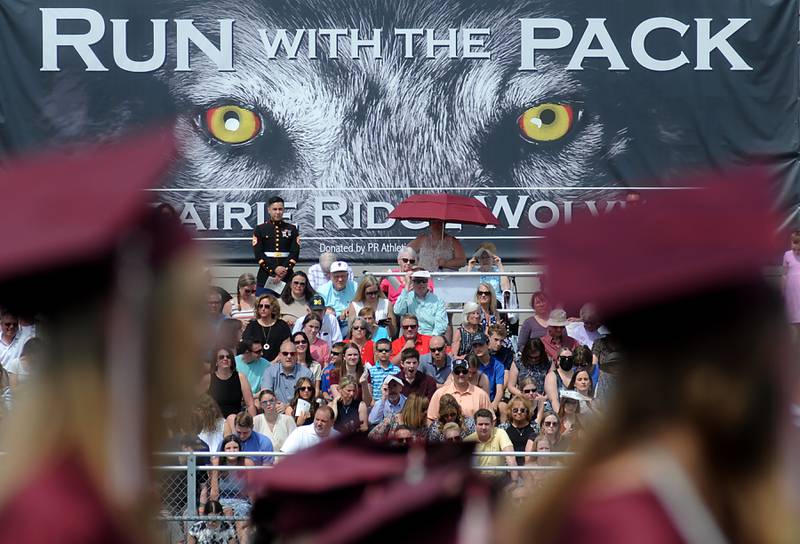 People watch as the graduates get their diplomas Saturday, May 14, 2022, during the graduation ceremony at Prairie Ridge High School.