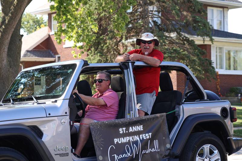 Terry Sirois, 2025 parade grand marshal, travels along Station Street in the Grand Pumpkin Parade during the St. Anne Pumpkin Festival on Saturday, Oct. 4, 2025.