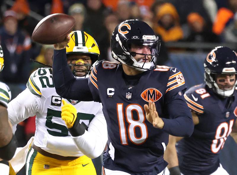 Chicago Bears quarterback Caleb Williams is pressured by Green Bay Packers defensive end Rashan Gary as he throws a pass Saturday, December 20, 2025, during their game at Soldier Field in Chicago.