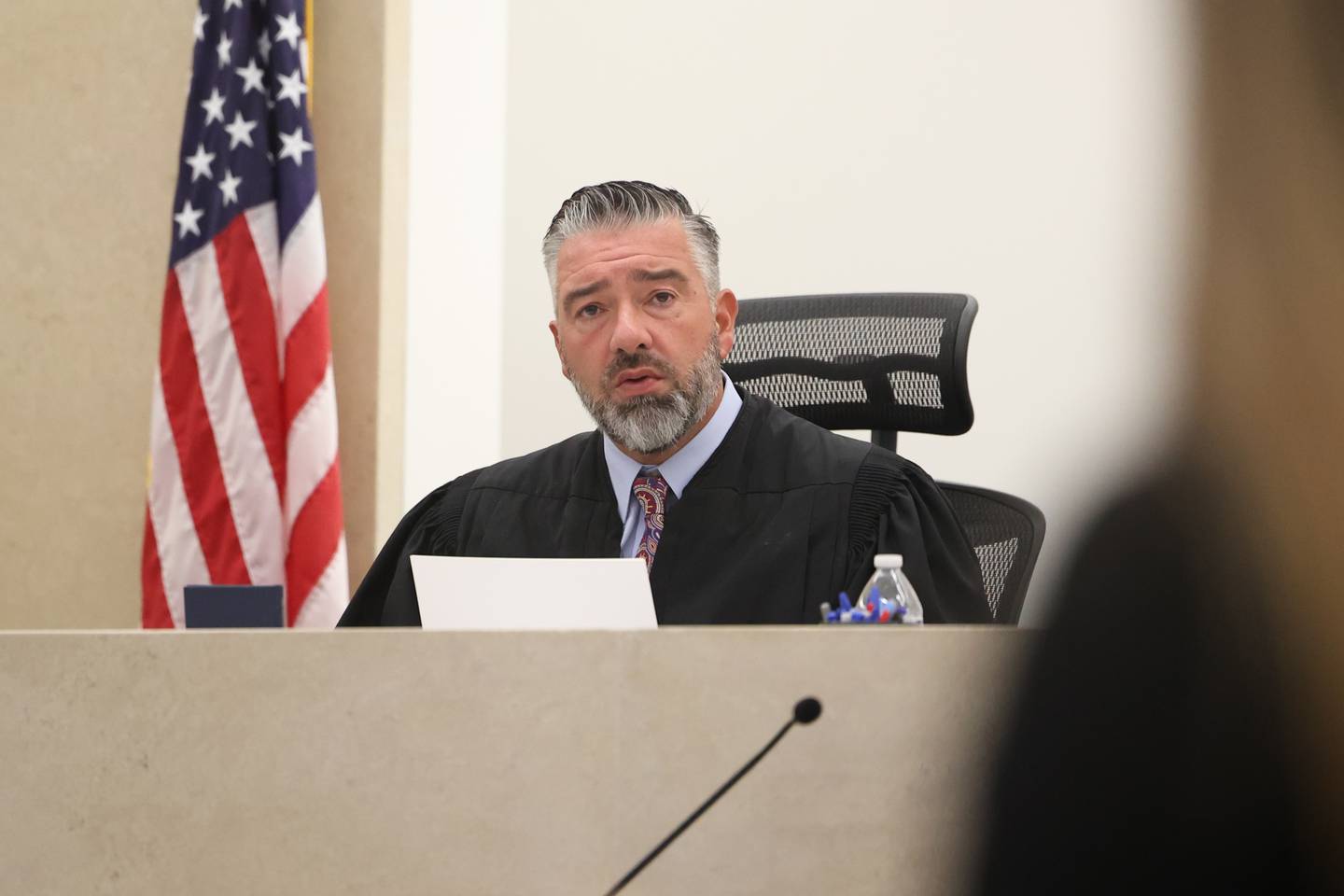 Judge Dave Carlson talks with the prosecution team before the start of the trial of Jermaine Mandley, 47, of Bolingbrook, at the Will County Courthouse on Thursday, Aug. 17, 2023 in Joliet. Mandley is on trial for the alleged shooting of Maya Smith, 24, in June 2022.