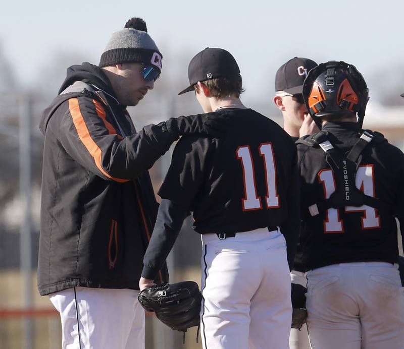Crystal Lake Central pitching coach Austin Padjen talks to pitcher John Gariepy during a nonconference baseball game against Boyland Wednesday, March 29, 2023, at Crystal Lake Central High School. Crystal Lake Central defeat Boylan 10-9.