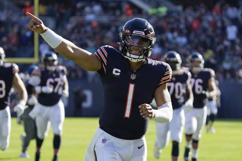 Chicago Bears quarterback Justin Fields points as he runs to the locker room after the first half  against the Miami Dolphins, Sunday, Nov. 6, 2022 in Chicago.