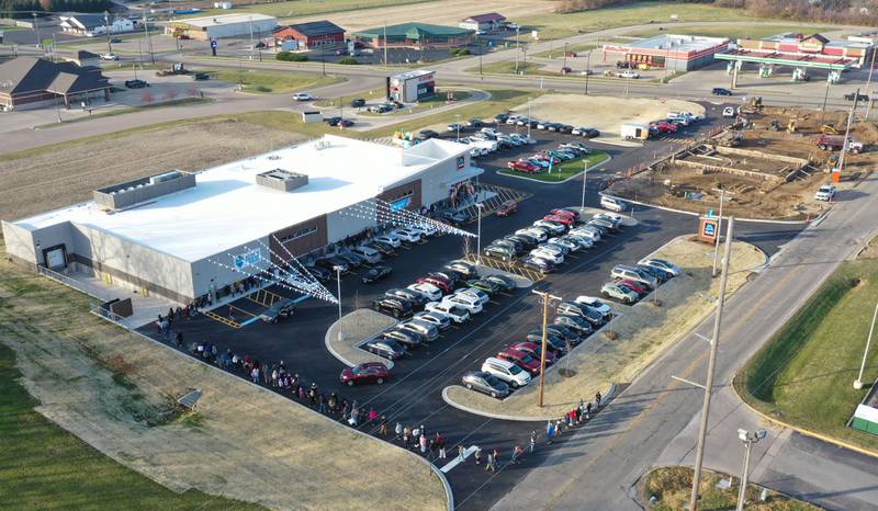 An aerial view of the new Aldi grocery store on Thursday, Nov. 13, 2025 at the corner of Backbone Road and North Main Street  in Princeton. The 12,000 square feet store began construction in May of this year. The first 100 people in line were given a chance to win a golden ticket to win a $100 gift card. Hundreds of people waited in line for free gift bags. The store hours are 9a.m.-8p.m. daily. A Jersey Mikes Subs will be built on the top corner of the photo.