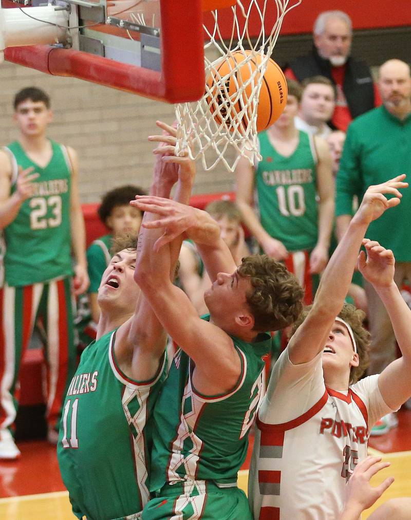 L-P's Jameson Hill and teamamte Regan Doerr miss a rebound with Morton's Collin Burns during the Class 3A Sectional semifinal game on Tuesday, March 3, 2026 in Kingman Gymnasium at Ottawa High School.