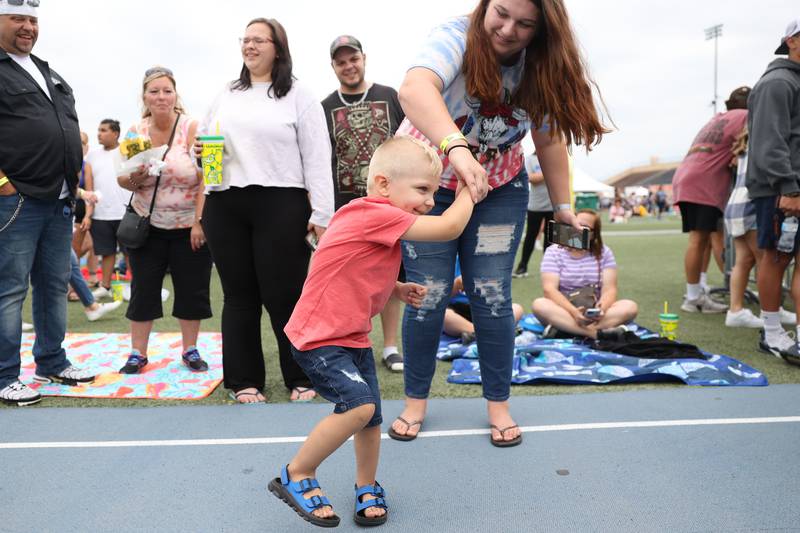 Niklaus Penrod, 3-years old, dances with his mom Angelica Pink on day 2 of the Taste of Joliet. Saturday, June 25, 2022 in Joliet.