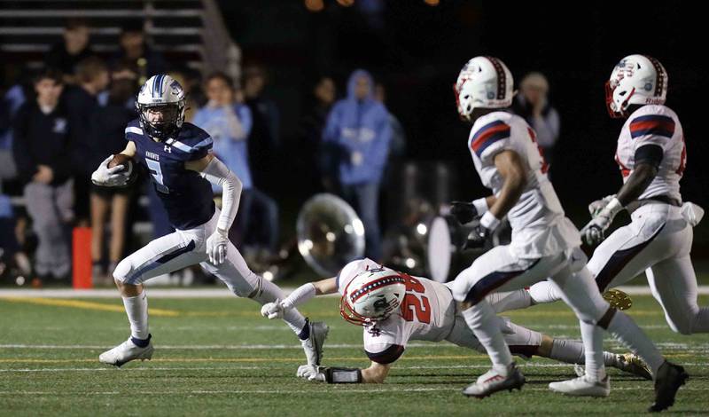 Prospect's Jake Parisi (2) turns upfield during the second round of the IHSA Class 7A Playoffs Friday November 4, 2022 in Mount Prospect.