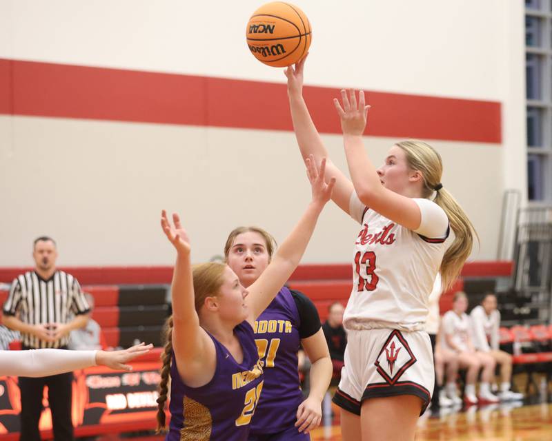 Hall's Caroline Morris takes a jump shot over Mendota's Emily Sondgeroth and teammate Addison Perryman on Monday, Dec. 1, 2025 at Hall High School.