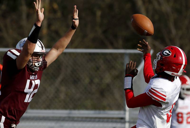 Prairie Ridge's Hunter Mosolino rushes Chicago Goode's Zacharias Pagan as he tries to throw a pass during an IHSA Class 5A first-round football game on Saturday, Nov. 2, 2024, at Prairie Ridge High School in Crystal Lake.