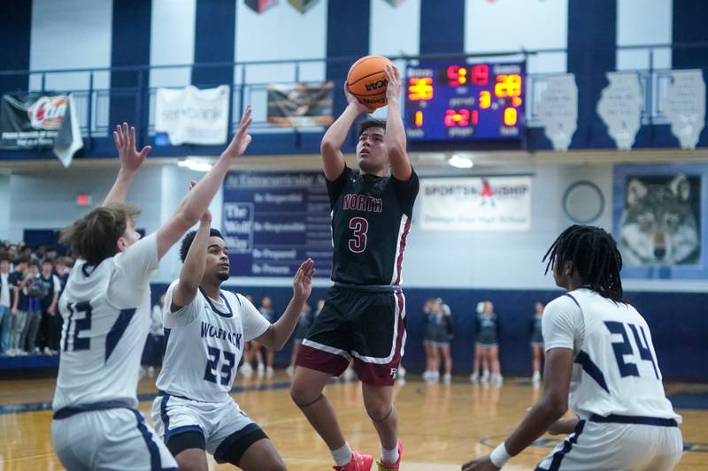 Plainfield North's Lukas Alvarez (3) shoots the ball in the paint against Oswego East during a basketball game at Oswego East High School on Friday, Dec. 6, 2024.