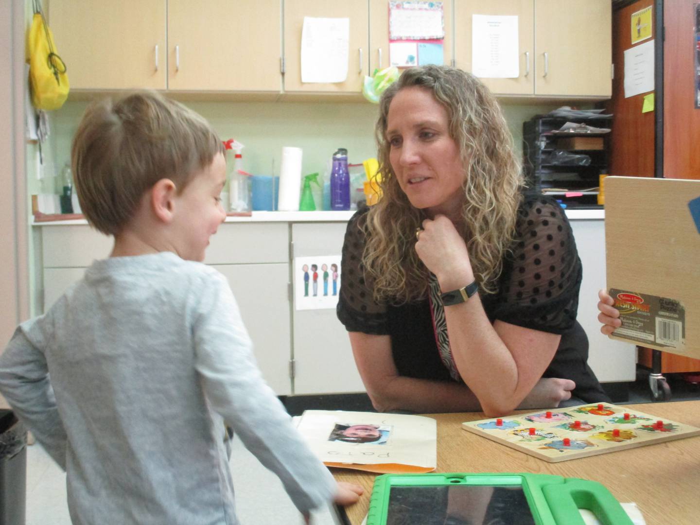 Preschool teacher Gretchen Wheatley works to build the self-confidence of her students at Brokaw Early Learning Center in Oswego.