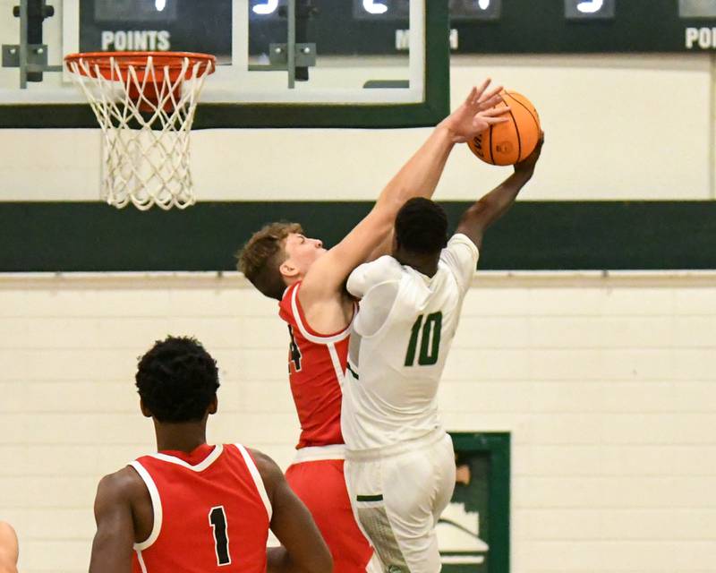 Glenbard West's Josh Abushanab (10) goes up for a shot and gets fouled by Glenbard East's Sam Walton (24) on Wednesday Nov 26, 2025, during the District 87 Thanksgiving Invitational held at Glenbard West High School. game on Wednesday Nov. 26, 2025,
