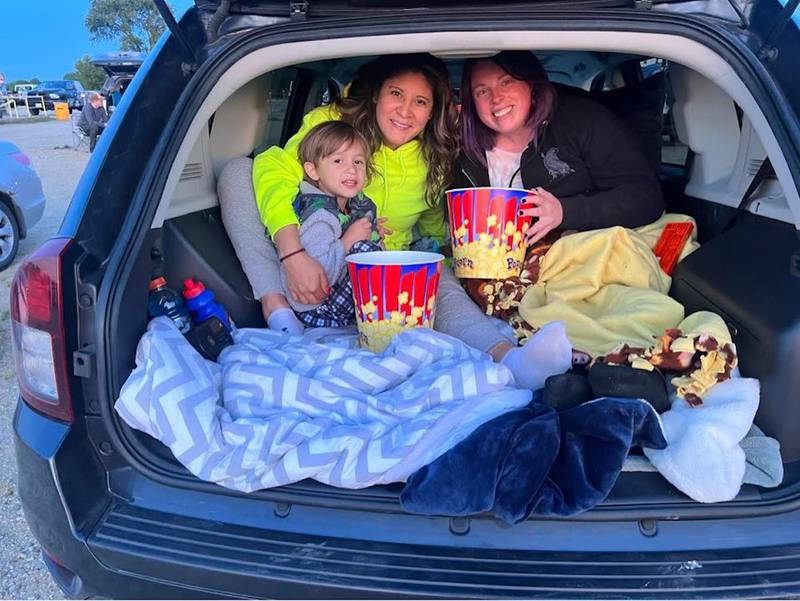 Movie-goers bundle up in the back of a car at the McHenry Outdoor Movie Theater.