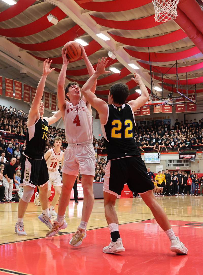 Hinsdale Central's Chase Collignon (4) puts up a shot during the boys 4A varsity sectional semi-final game between Hinsdale Central and Lyons Township high schools in Hinsdale on Wednesday, March 1, 2023.