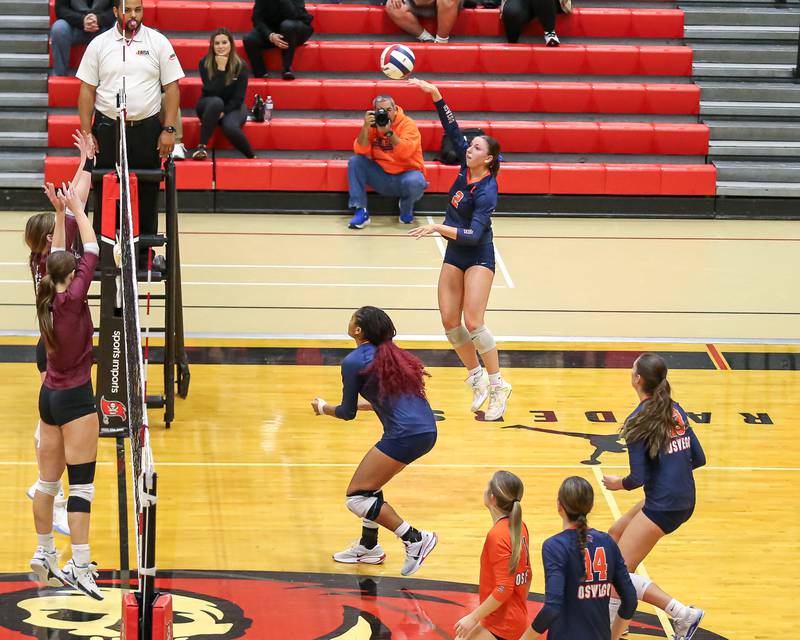 Oswego's Kelsey Foster (2) spikes the ball during Class 4A Bolingbrook Sectional final match between Lockport at Oswego.  Nov 7, 2024  in Bolingbrook.