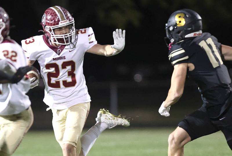 Morris' AJ Zweeres tries to fend off Sycamore's Burke Gautcher during their game Friday, Oct. 21, 2022, at Sycamore High School.