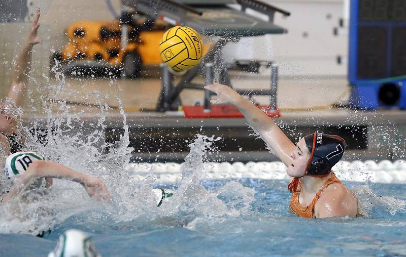 Hersey's Cassie Gankhuleg (17) shoots over York’s Jane Marlott (18) during the IHSA State Water Polo consolation match Saturday May 20, 2023 at Stevenson High School in Lincolnshire.