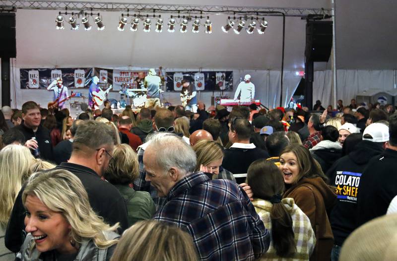 Hundreds pack an outside tent for a performance by Modern Day Romeos during the 39th annual Turkey Testicle Festival at Parkside Pub on Wednesday, Nov. 24, 2021, in Huntley.