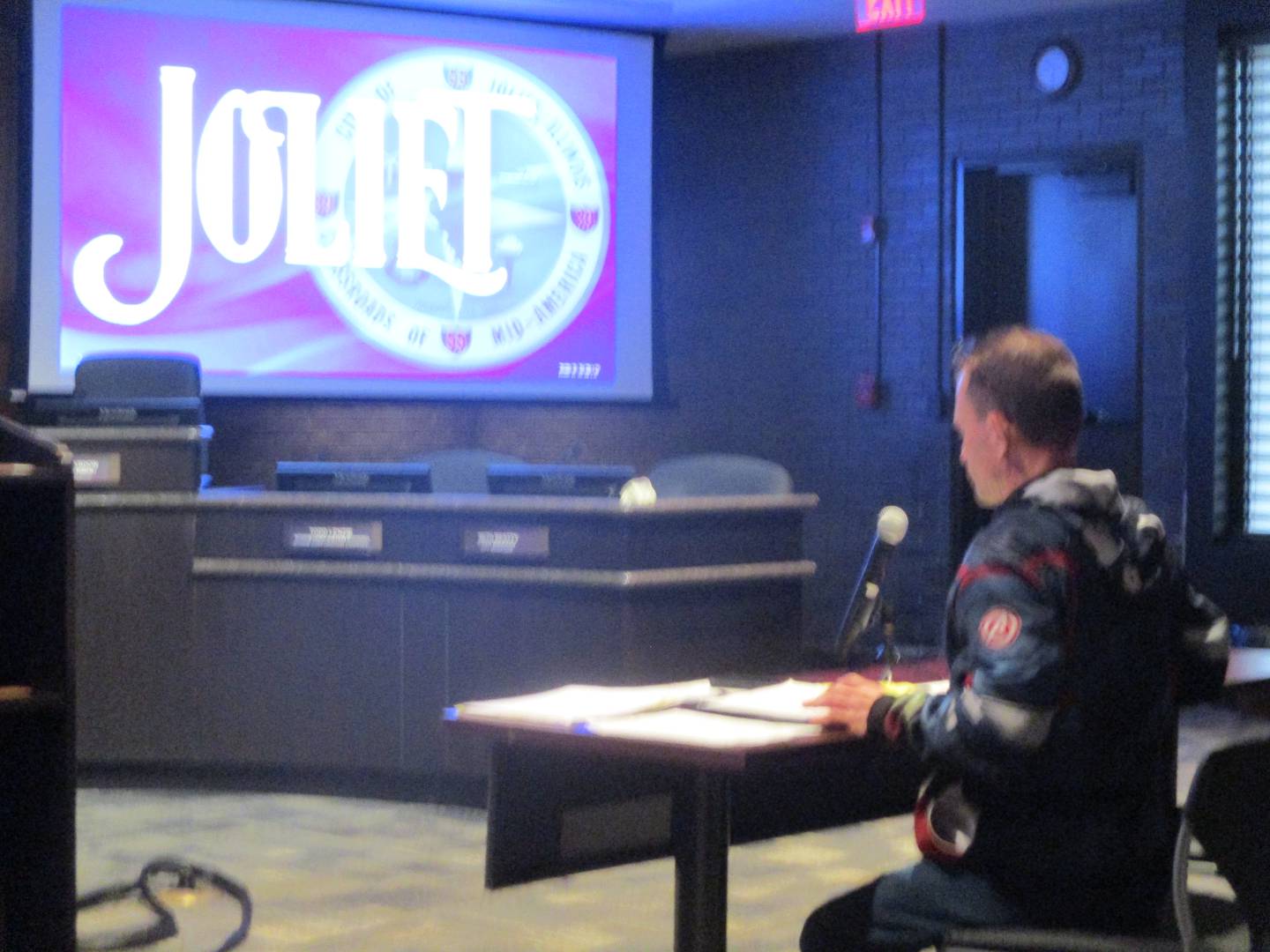 Jim Lanham awaits his opportunity to address the Joliet electoral board on Monday before being thrown off the ballot for the April 1 election for city council.