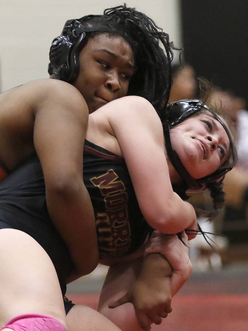 DeKalb’s Kayden Johnson tries to control Morris’ Nicolette Boleman in the 155-pound match of a nononference wrestling meet on Wednesday, Jan. 22, 2025, at Huntley High School.