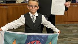 Oswego flying honorary village flag designed by 9-year-old boy