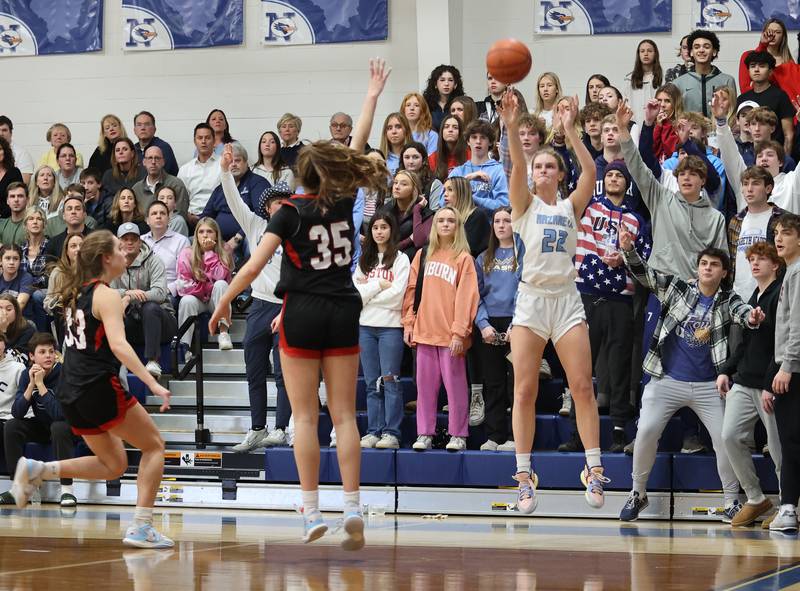 Nazareth's Gracie Carstensen (22) takes a three-point shot during the girls varsity basketball game between Benet and Nazareth academies on Wednesday, Jan. 3, 2023 in La Grange Park, IL.