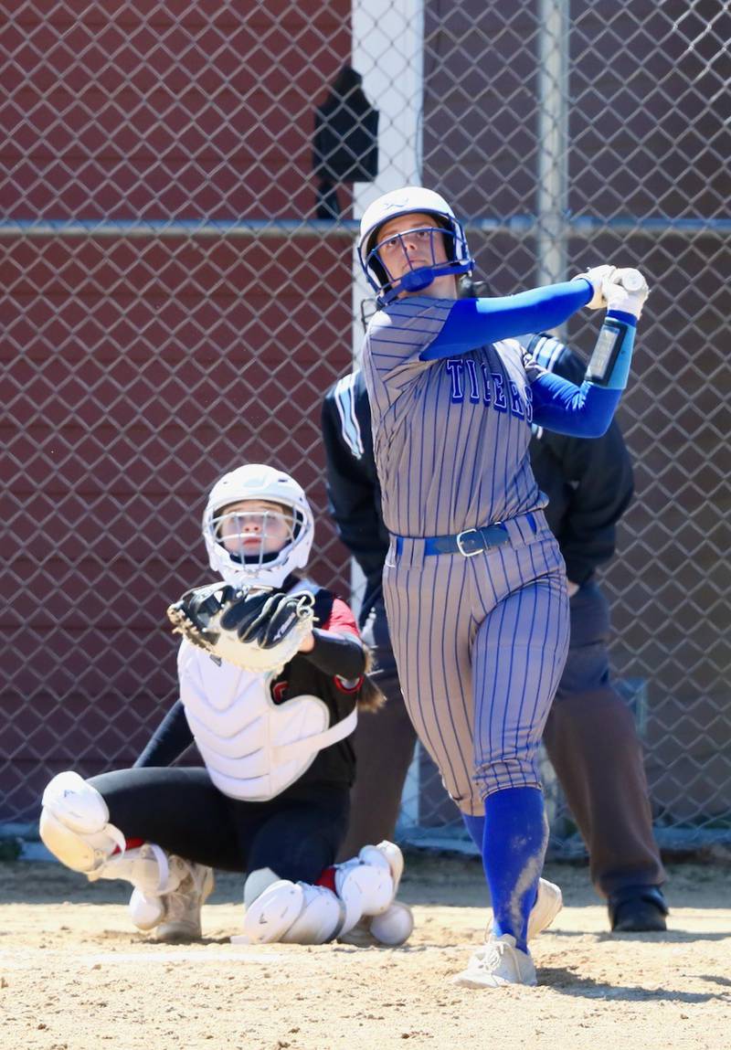 Princeton's Ellie Harp watches her home run ball take flight Saturday at Hall.