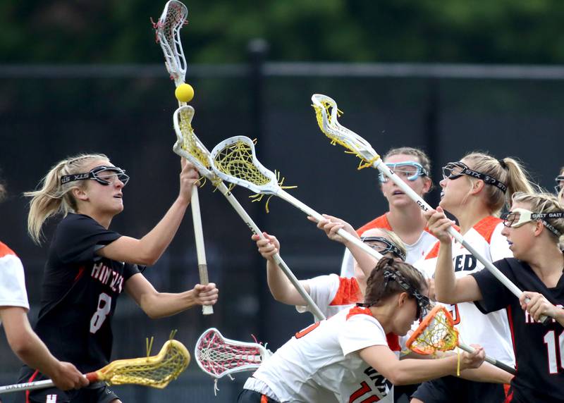 Huntley’s Lauren Cardinal, left, corrals the ball amidst a swarm of players  in IHSA Sectional Title Game action at Crystal Lake Central High School in Crystal Lake on Friday, May 30, 2025.