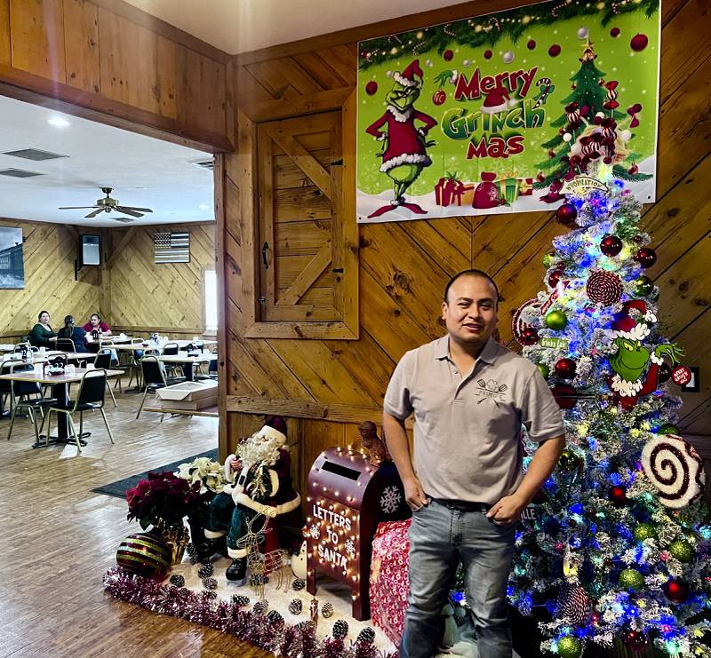 Edgar Xique, owner of Primo's Bar & Grill in Sterling, stands ready to greet customers on opening day Friday, Dec. 6, 2024.
