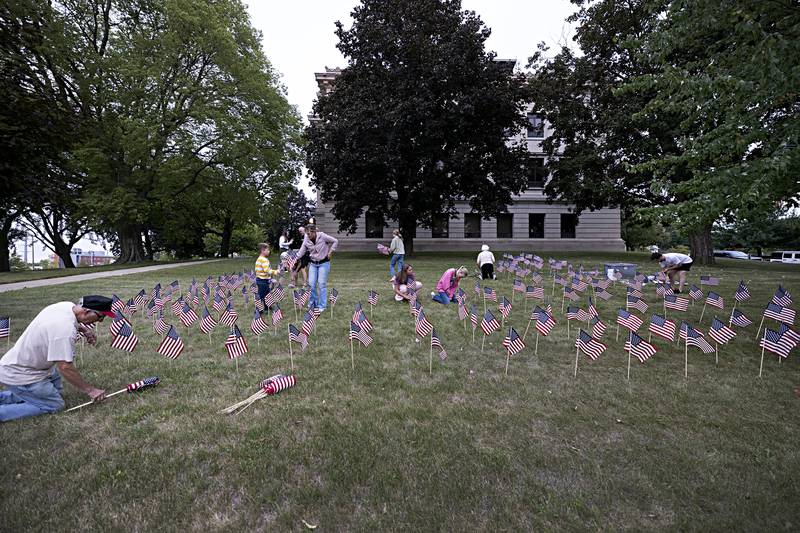 2,977 flags are being placed on the lawns of the Old Lee Courthouse and the Reagan Boyhood Home in Dixon Wednesday, Sept. 6, 2023.