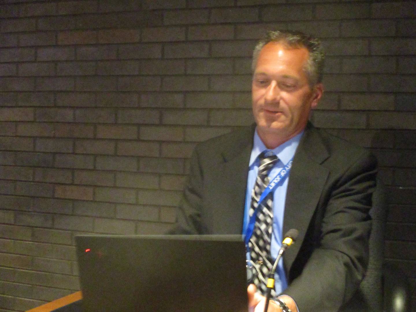 Kevin Sing, finance director and interim city manager for the city of Joliet, reviews items on his laptop before the start of the City Council meeting on Tuesday, June 6.