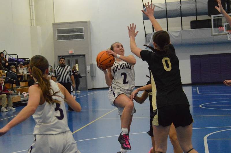 Rochelle's Mackenzie Bybee gets fouled as she drives to the hoop during a JV basketball game with Sycamore.