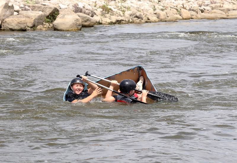 Participants of the cardboard boat race start sinking during Yorkville River Fest on Saturday, July 19, 2025.