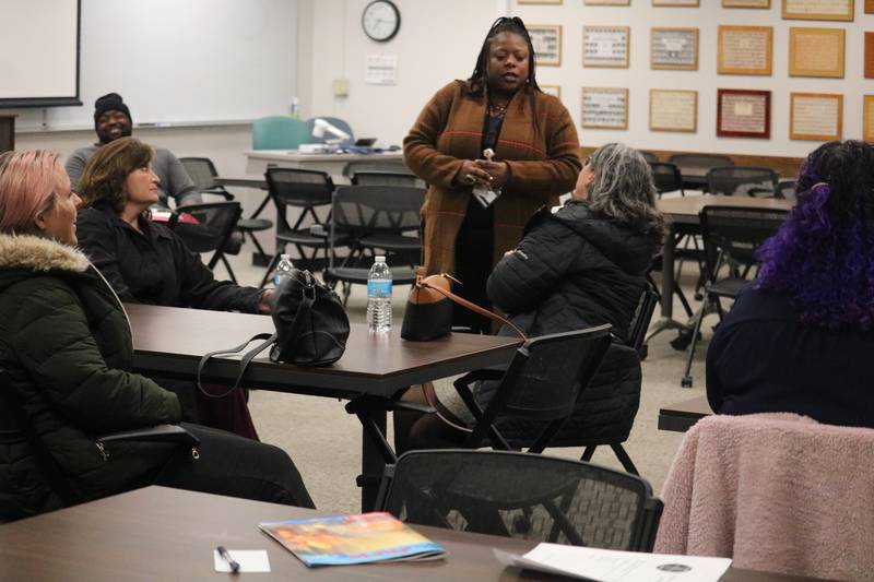 Director of Diversity, Equity and Inclusion Amonaquenette Parker (center) speaks Tuesday, Nov. 29, 2022 during a community conversation put on by DeKalb District 428 schools.