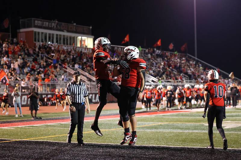 Bradley-Bourbonnais' LyZale Edmon celebrates his touchdown with teammate Austin Snyder, right, during the Boilermakers' 35-6 victory over Waubonsie Valley Friday, Sept. 12, 2025.