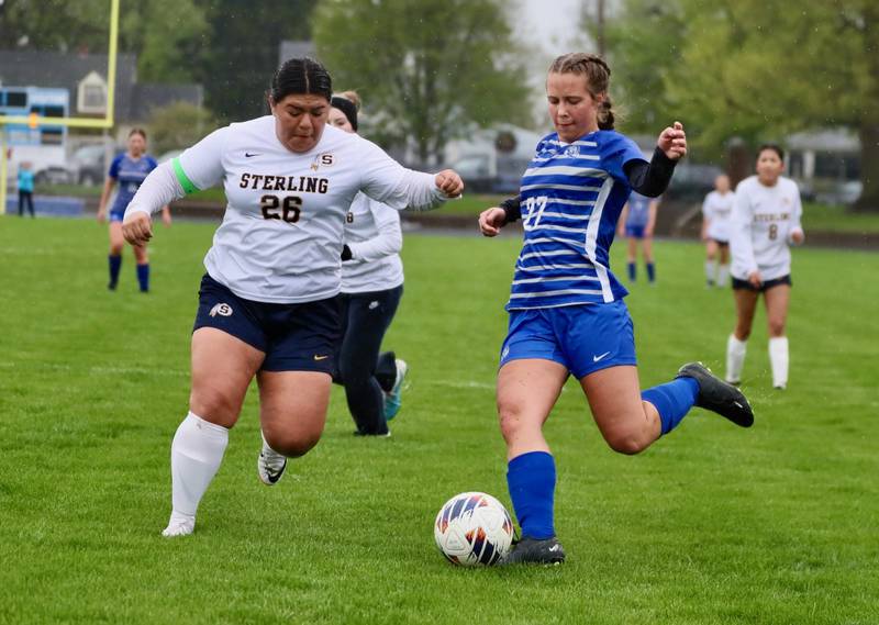 Princeton's Ava Kyle takes aim for a kick against Sterling's  Michelle Diaz Thursday at Bryant Field. The Tigresses won 3-1.