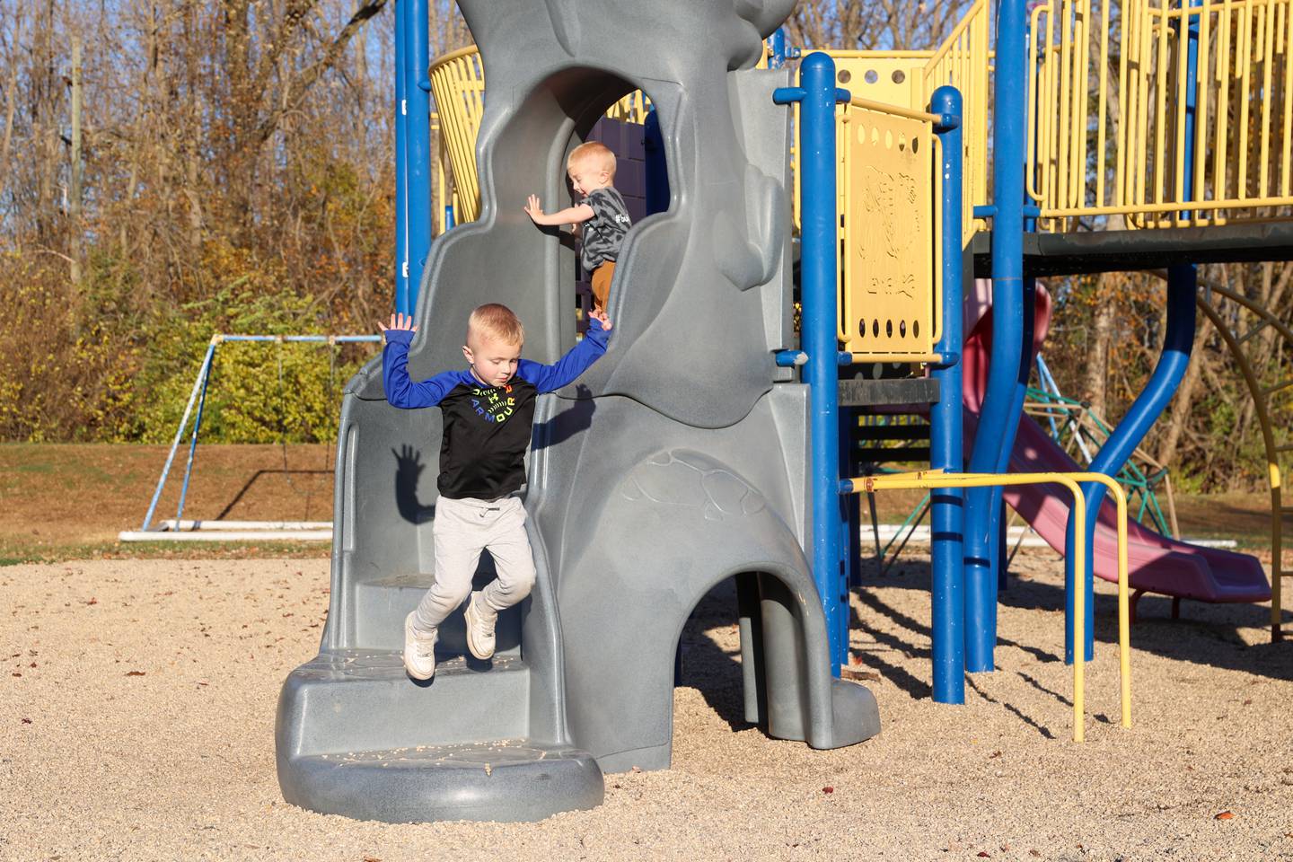 Bedford Erickson, 2.5, above, plays on the playground with his brother, Link, 4, at Grace Christian Academy on Nov. 7, 2025. Erickson, who was born with Schwartz-Jampel Syndrome, was selected for a fundraiser to bring an inclusive playground to the school, where he'll start next year.