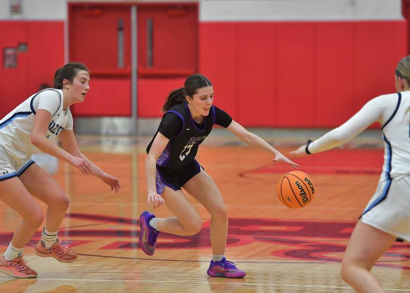 Downers Grove North’s Caitlin Sandridge tries to recover a loose ball after it was tipped away from her by Nazareth’s Sophia Towne (left) during the Class 4A Hinsdale Central Sectional final game on February 26, 2026 at Hinsdale Central High School in Hinsdale.
