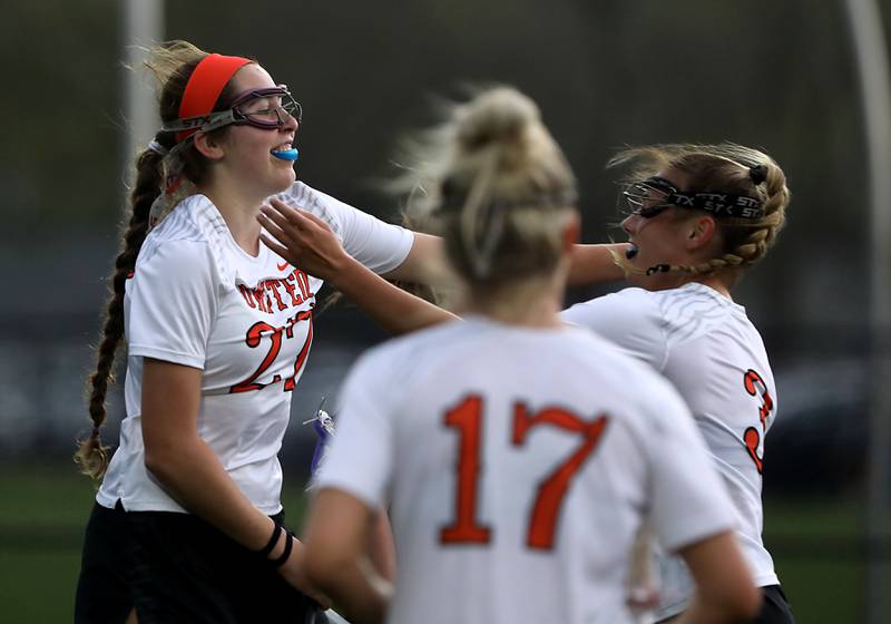 Crystal Lake Central co-op's Anna Starr (left) celebrates with Crystal Lake Central co-op's Makayla Simonic after a Crystal Lake co-op goal during a Fox Valley Conference girls lacrosse match against Huntley on Friday, April 17, 2026, at Crystal Lake Central High School.