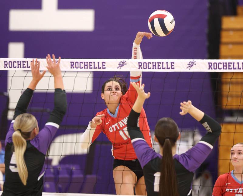 Ottawa's Bella Knoll spikes the ball against Dixon Tuesday, Oct. 28, 2025, during their Class 3A regional semifinal match at Rochelle High School.