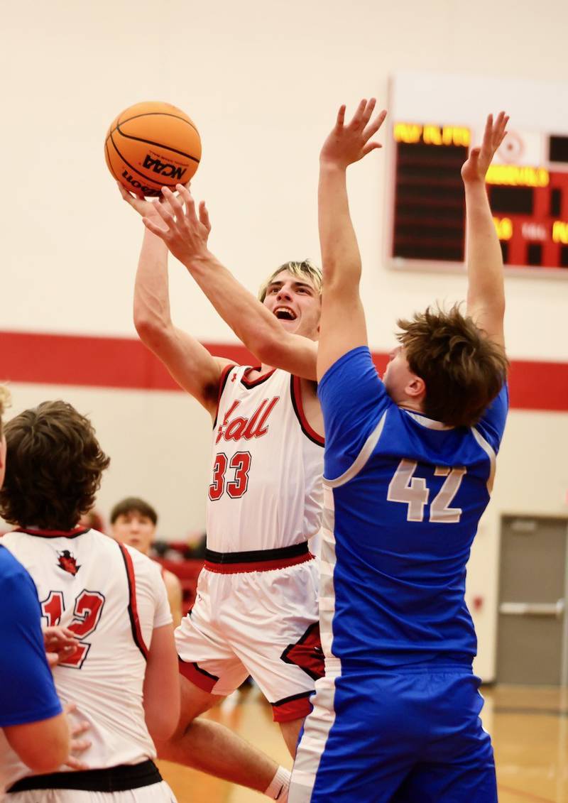 Hall's Braden Curran shoots between Princeton's Jackson Mason (left) and Luke Smith at the Colmone Classic on Friday night.