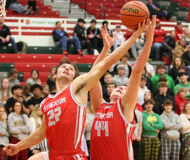 Streator's Christian Benning and teammate Nolan Lukach grab a rebound against L-P on Thursday, Jan. 28, 2023 at L-P High School.