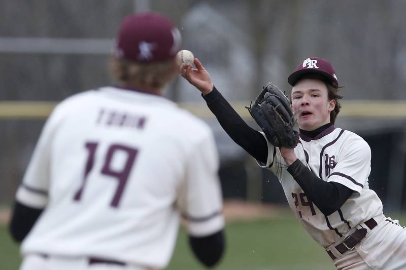 Prairie Ridge's Matt Smith throws the ball to first baseman Jack Tobin as he tries to get the runner out during a Fox Valley Conference baseball game Friday, April 29, 2022, between Prairie Ridge and Jacobs at Prairie Ridge High School.