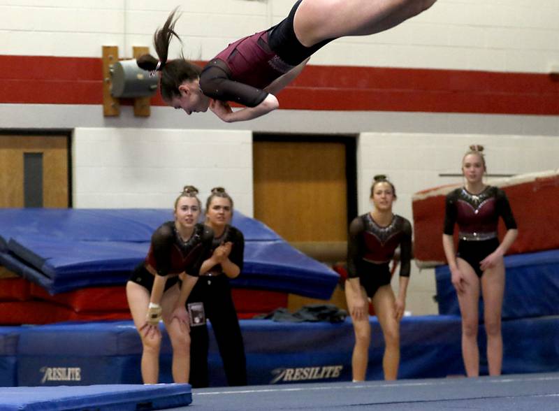 Prairie Ridge’s Tess Morton competes on the floor exercise as her teammates watch during the IHSA Mundelein Gymnastics Sectional on Feb. 13, 2025, at Mundelein High School.