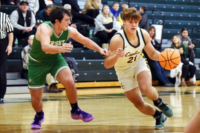Coal City's Julian Micetich (21) looks to drive around Dwight's Evan Cox during Saturday's game in Coal City. Micetich had 10 points, one of five Coalers in double figures in a 63-35 win.
