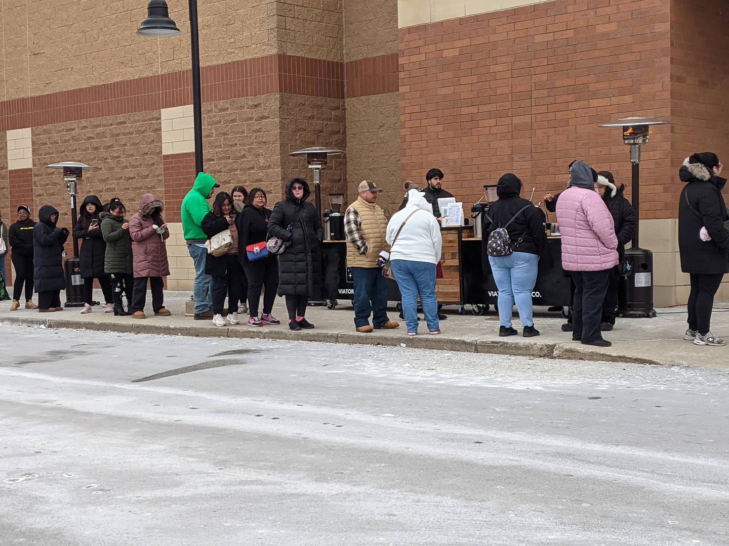 People stand in line on Feb. 8 waiting for Daiso to open its new store at 3040 Route 34 in the Oswego Commons shopping center.