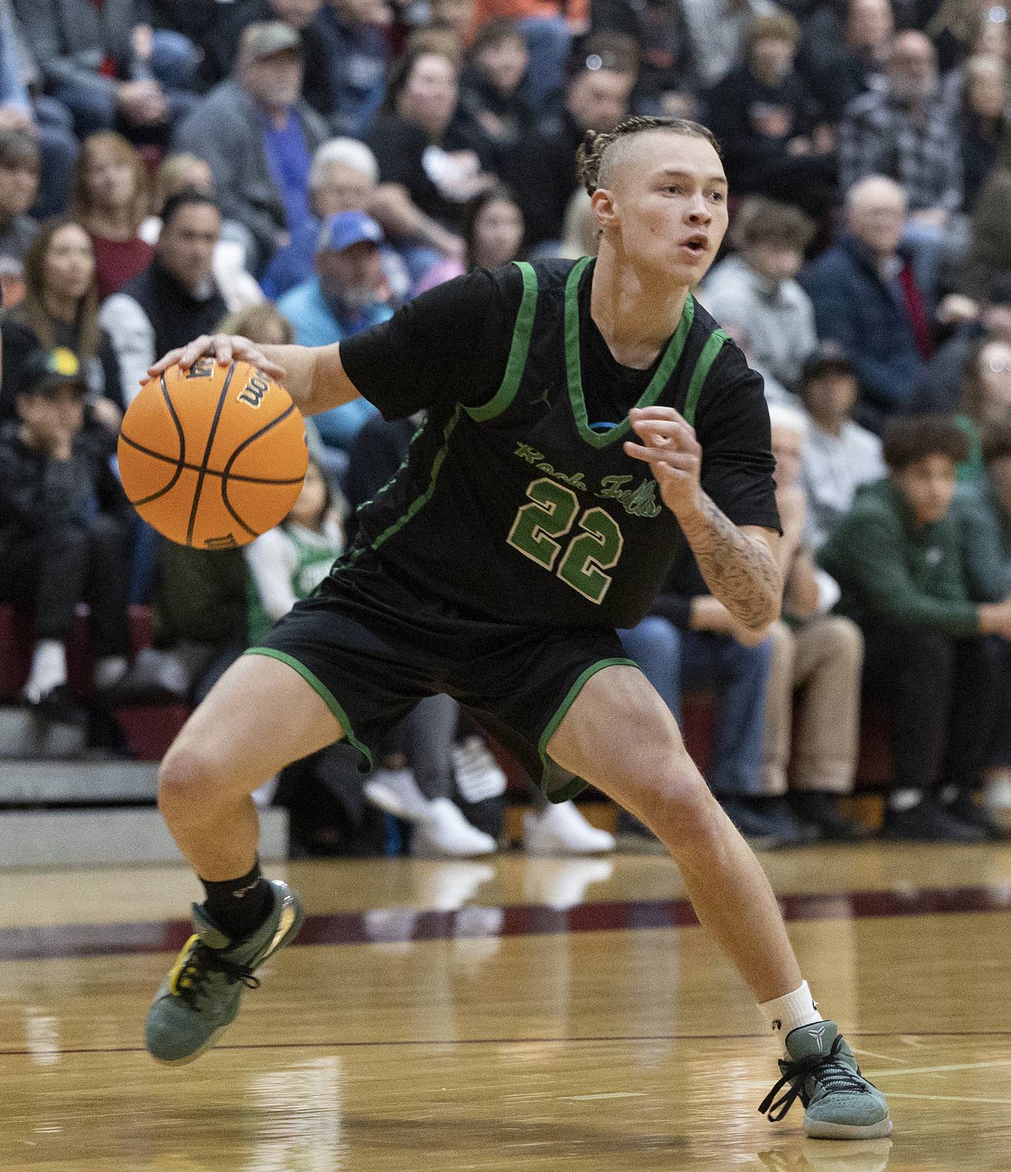Rock Falls’ Nehemiah Menendez handles the ball against Winnebago Tuesday, March 4, 2025, during the 2A boys basketball Sectional final at Marengo.