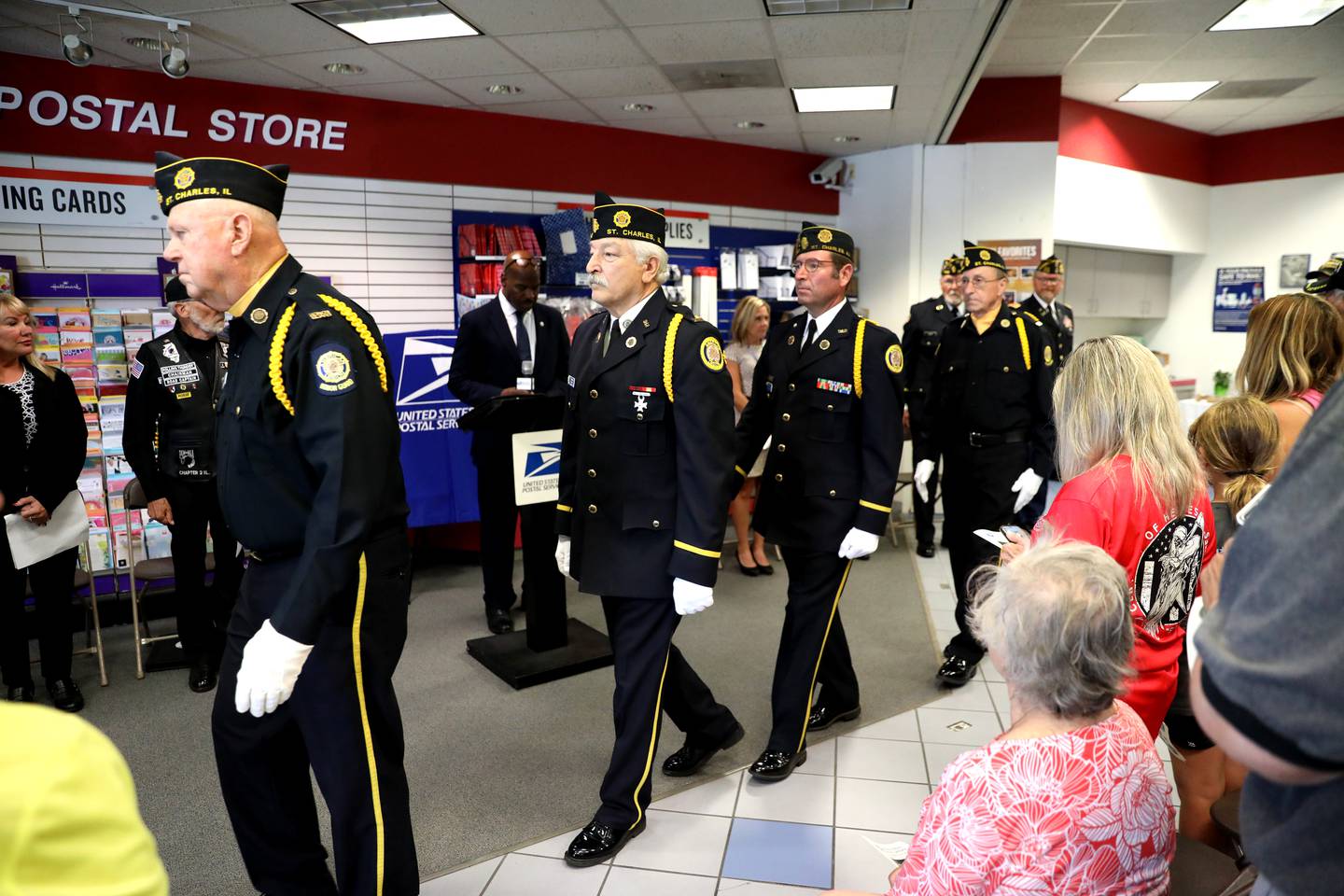 St. Charles Veterans from American Legion Post 342, AMVETS Post 503, VFW Post 5036 and Vietnam Veterans of America Chapter 693 march to present the colors during a naming ceremony of the East Side Post office in St. Charles. The post office has been renamed the Veterans of the Vietnam War Memorial Post Office.